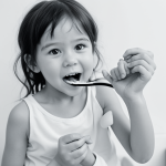 A simple black and white line art image of a child brushing their teeth, designed for coloring books with clean outlines and blank fill areas.