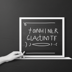 Simple black and white vector line art of a teacher writing on a chalkboard, featuring bold outlines and minimal composition, ideal for a children's coloring page.